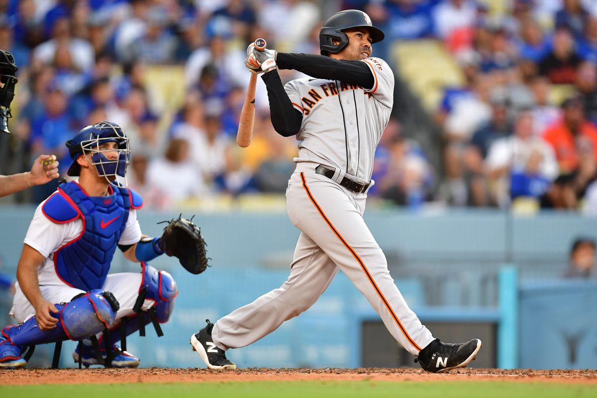 SF Giants first baseman LaMonte Wade Jr. hits a three-run home run against the Los Angeles Dodgers in the fifth inning at Dodger Stadium on June 17, 2023.